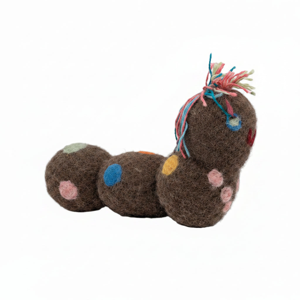 Caterpillar-shaped toy with colorful polka dots on a white background