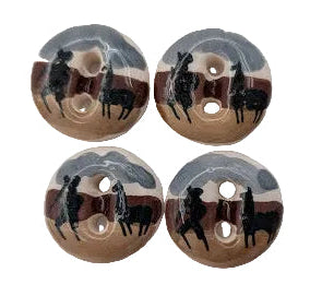 Four wooden buttons with black and gray designs on a white background