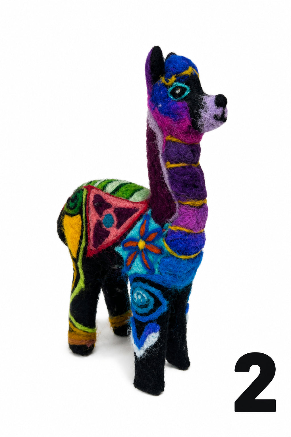 A colorful felt llama figurine decorated with vibrant geometric and floral patterns in purple, blue, green, yellow, pink, and black, set against a plain white background.