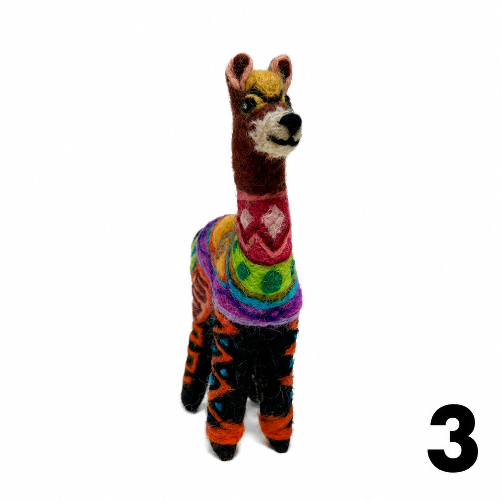 A handcrafted felt llama figurine with a multicolor patterned body, standing against a plain white background.