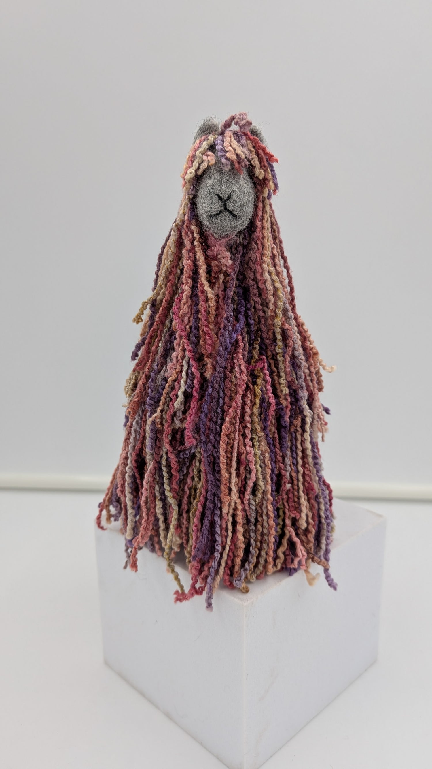 Textile art figure with long, braided hair handmade