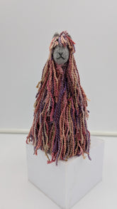 Textile art figure with long, braided hair handmade