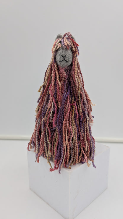 Textile art figure with long, braided hair handmade