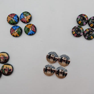 Colorful buttons with various designs on a white background