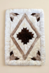 Shop our handmade alpaca fur wall hanging. Meticulously crafted with iconic geomettric patterns, it&