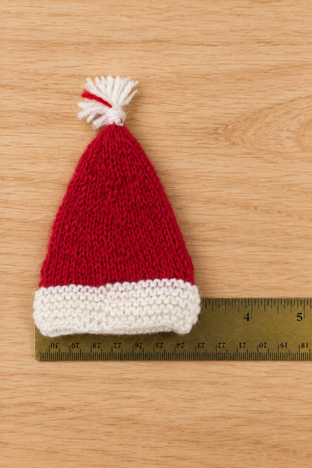 mini Santa hat and ruler to show the hat&