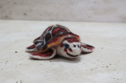 Close-up of a felted turtle
