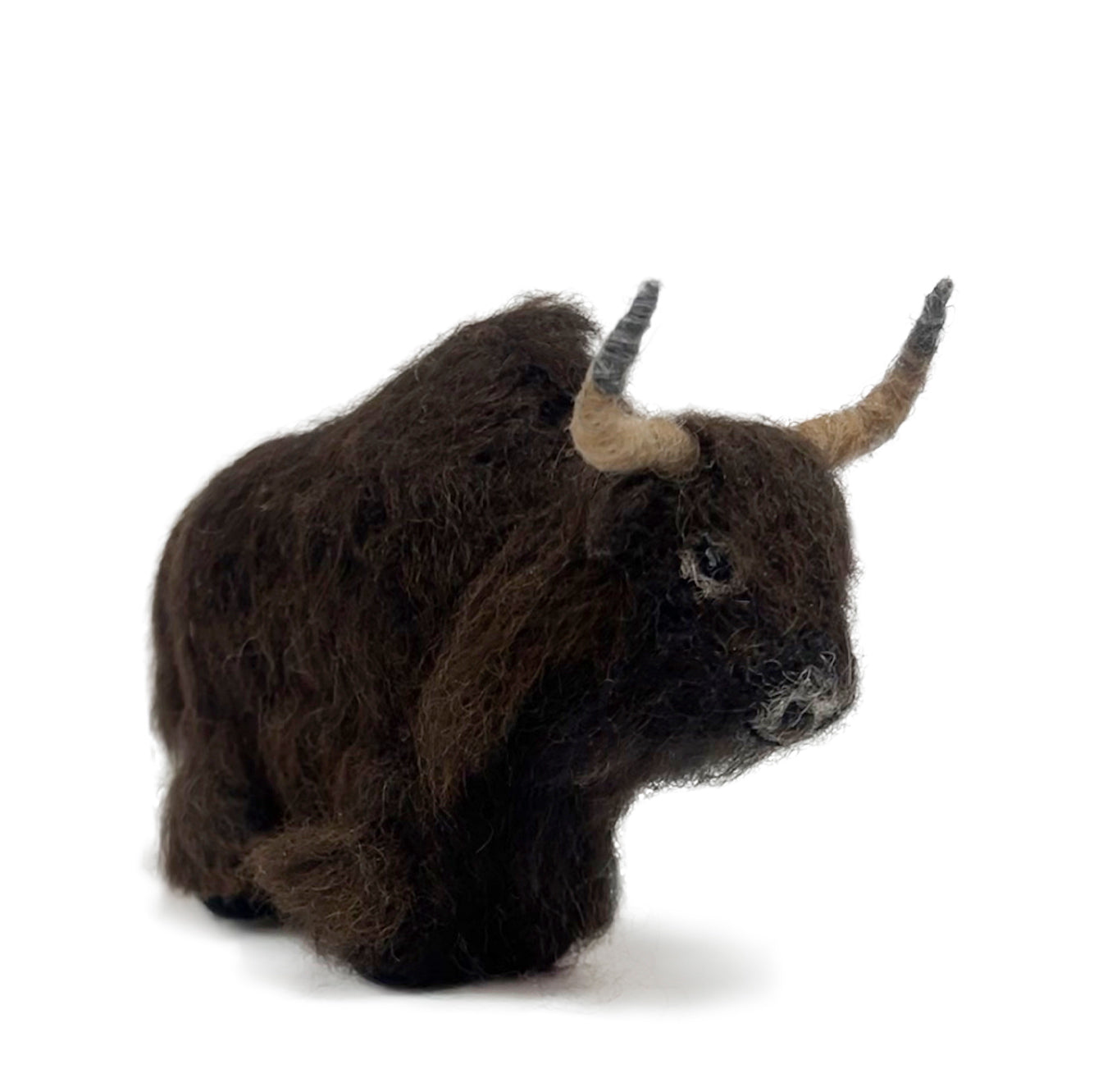 Plush sculpture of a brown yak on a white background