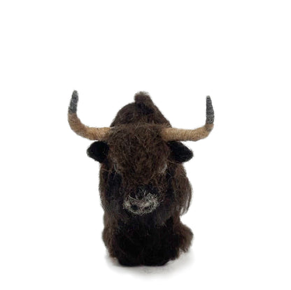 Felted wool sculpture of a yak head on a white background