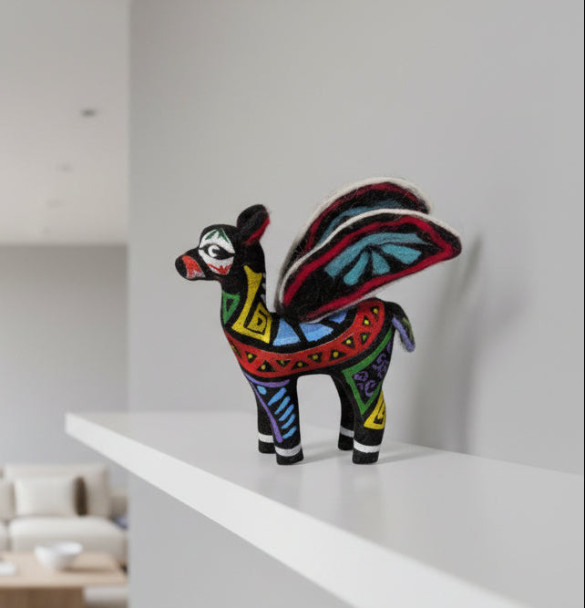 Colorful decorative animal figure on a white shelf with a neutral background