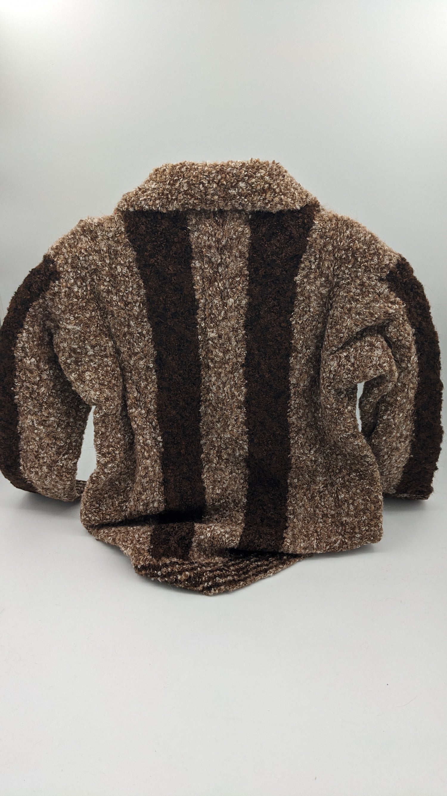 Kids brown and black striped cardigan sweater on a white background