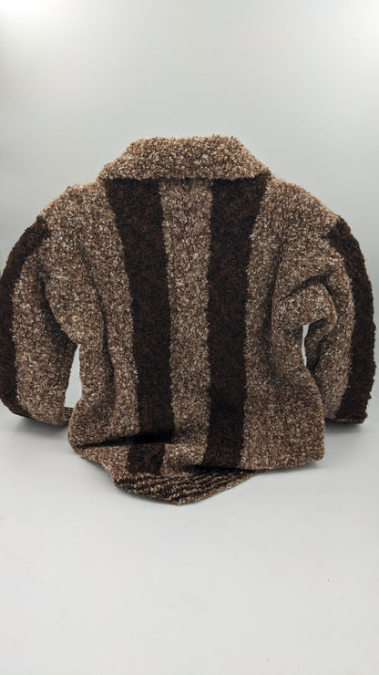 Kids brown and black striped cardigan sweater on a white background