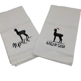 Two white towels with black alpaca designs and text on a light gray background