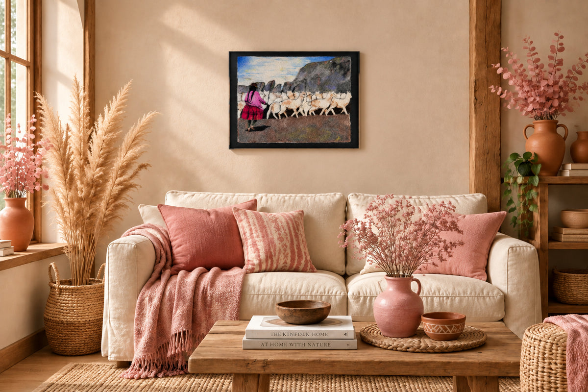 A painting of a Peruvian shepherd with her alpacas in the andes on a wall in a cozy living room.