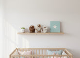 Nursery room with wooden crib and shelf displaying decorative heirloom lanart alpaca 
teddy bears..