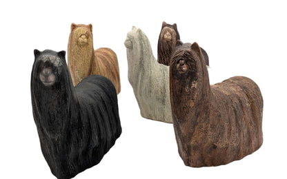 Stone sculptures of animals on a white background