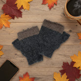 A pair of hand-knit fingerless gloves in dark gray and brown, displayed on a plain white background.