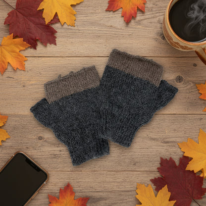 A pair of hand-knit fingerless gloves in dark gray and brown, displayed on a plain white background.