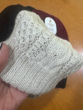 Detail of a baby alpaca beanie showing the hand-knit stitches.