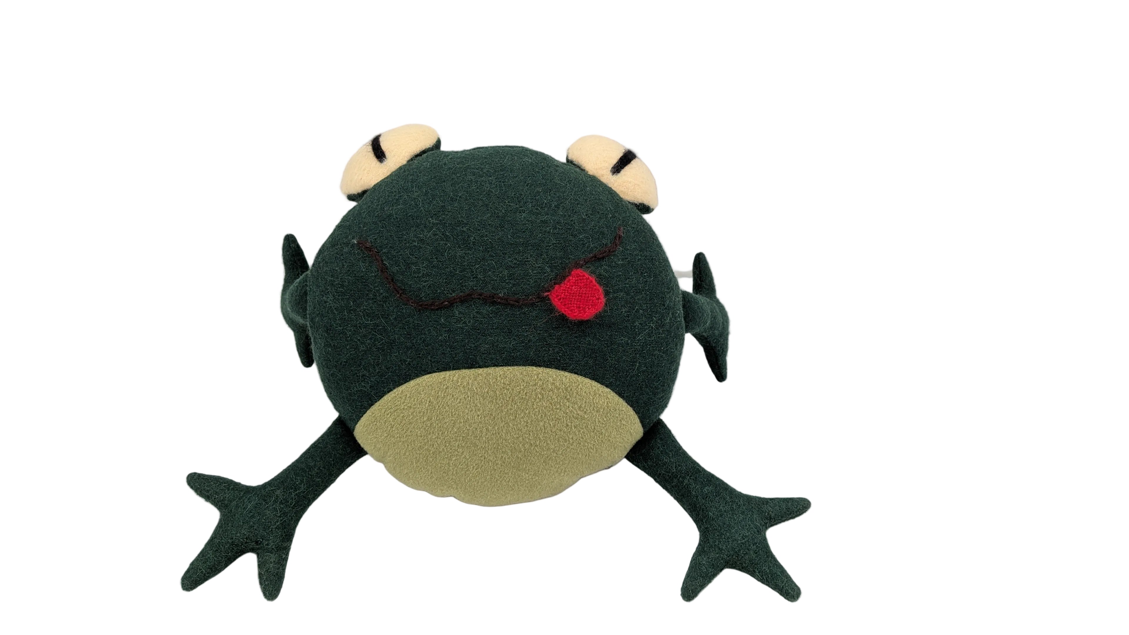 A plush frog toy with a dark green body, beige belly and feet, and a small red nose, photographed inside a white box.
