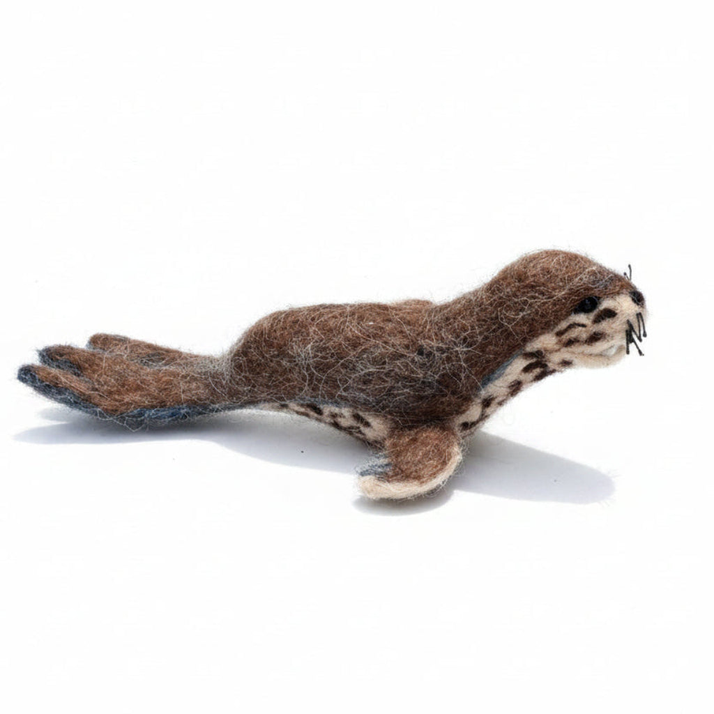 felted leopard seal on a white background