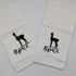 Two white towels with black llama graphics and text on a light gray background