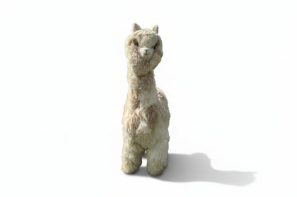 Stuffed alpaca toy on a white background
