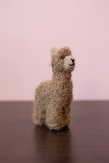 Needle felted tiny alpaca topper of a white jewelry box side view