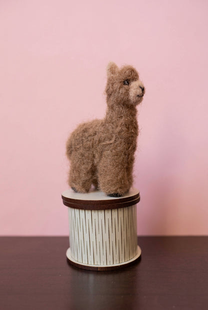 Needle felted tiny caramel alpaca topper of a white jewelry box
